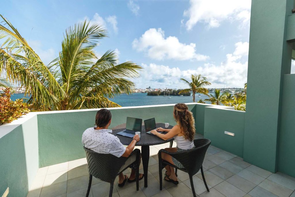 Couple working on their private balcony at Newstead Belmont Hills