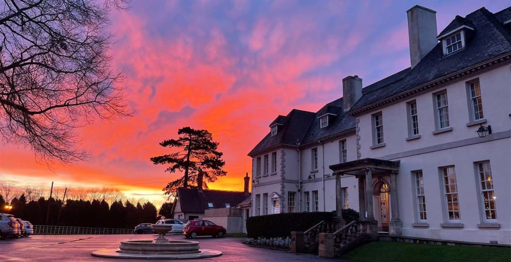 Brockencote hall building exterior at sunset