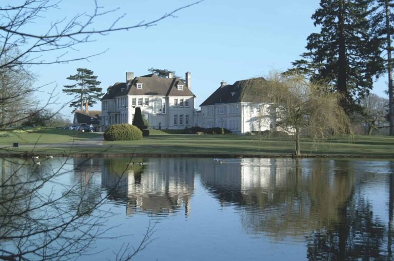 Brockencote Hall Hotel exterior overlooking a lake