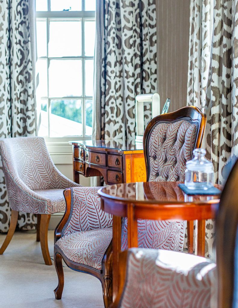 Cozy seating area filled with natural light at Brockencote Hall