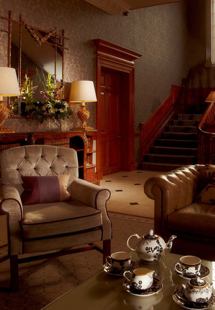 Cozy seating area with a tea set at Brockencote Hall