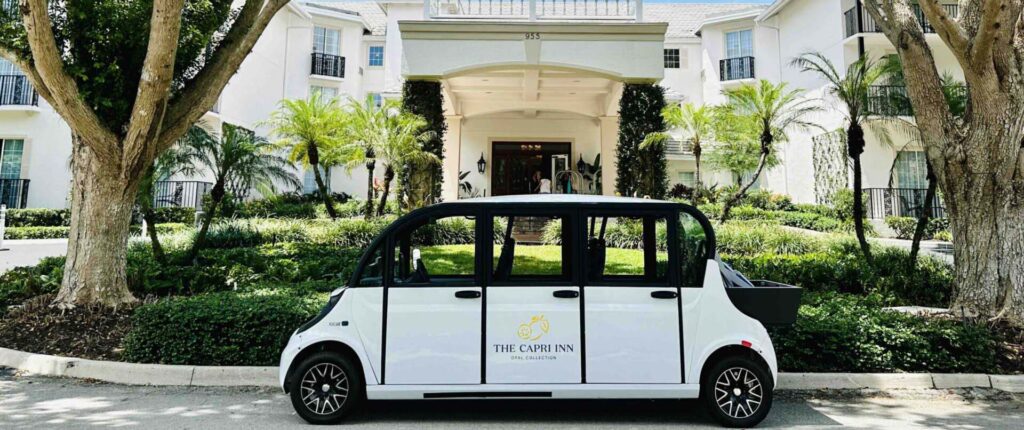 Capri Inn GEM electric cart parked in the front entrance