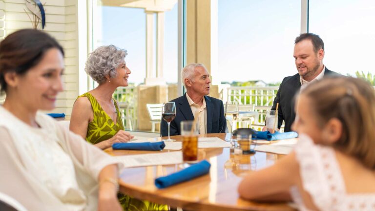 Multigenerational family sitting at a table in Euphoria Fish House
