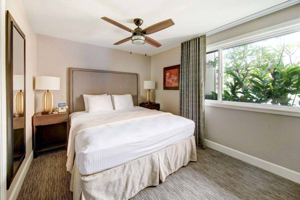 Large bed inside a Pono Kai Resort residence.