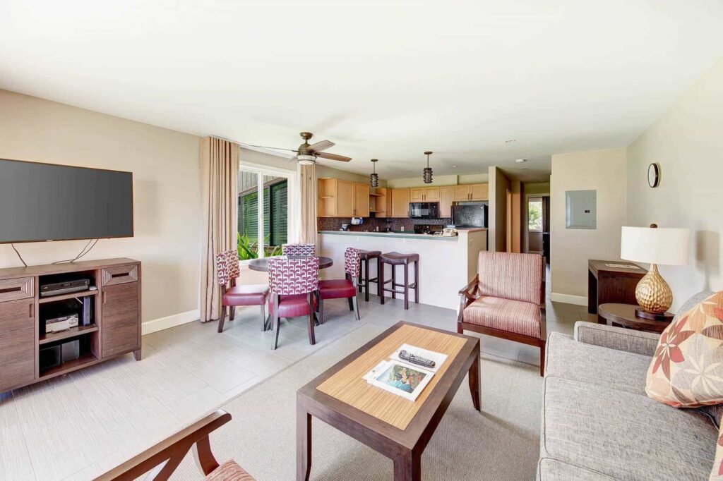 One Bedroom Deluxe living room with outdoor patio at Pono Kai Resort