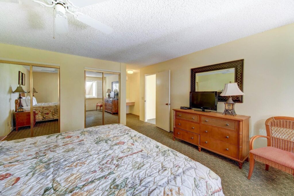 Master bedroom with large dresser in a Pono Kai Resort 2 Bedroom Unit