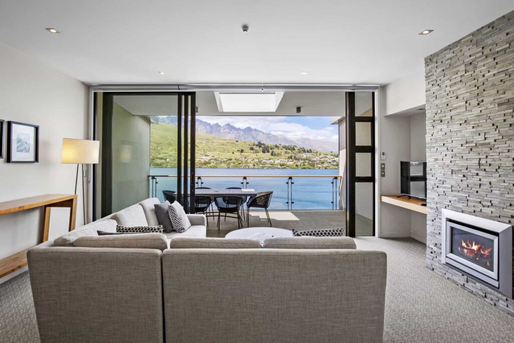 Executive Lake View One Bedroom Apartment living room with sofa and fireplace