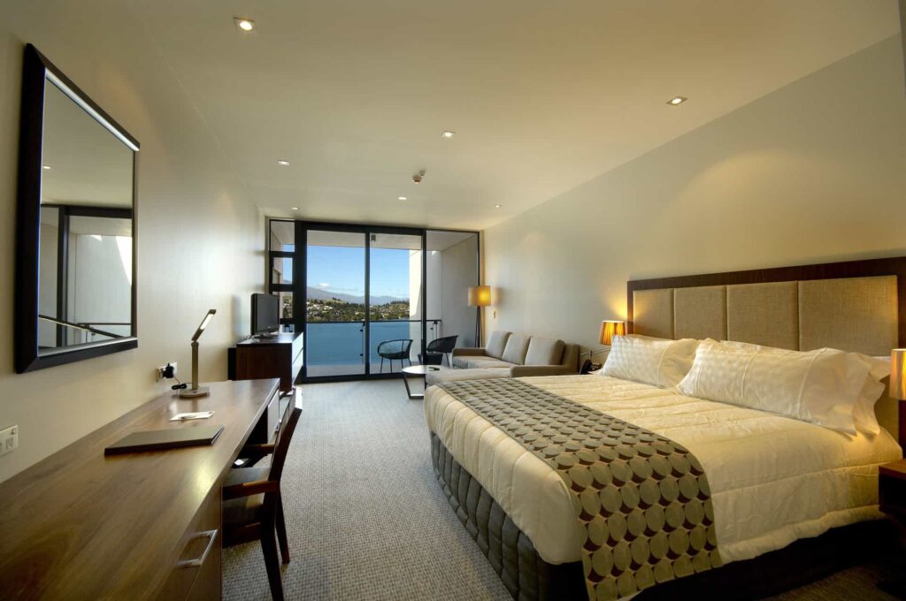 Executive Lake View Hotel Room with large king bed and balcony