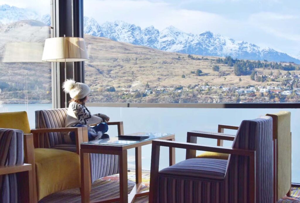 Child sitting in the lobby of the Rees Hotel, New Zealand