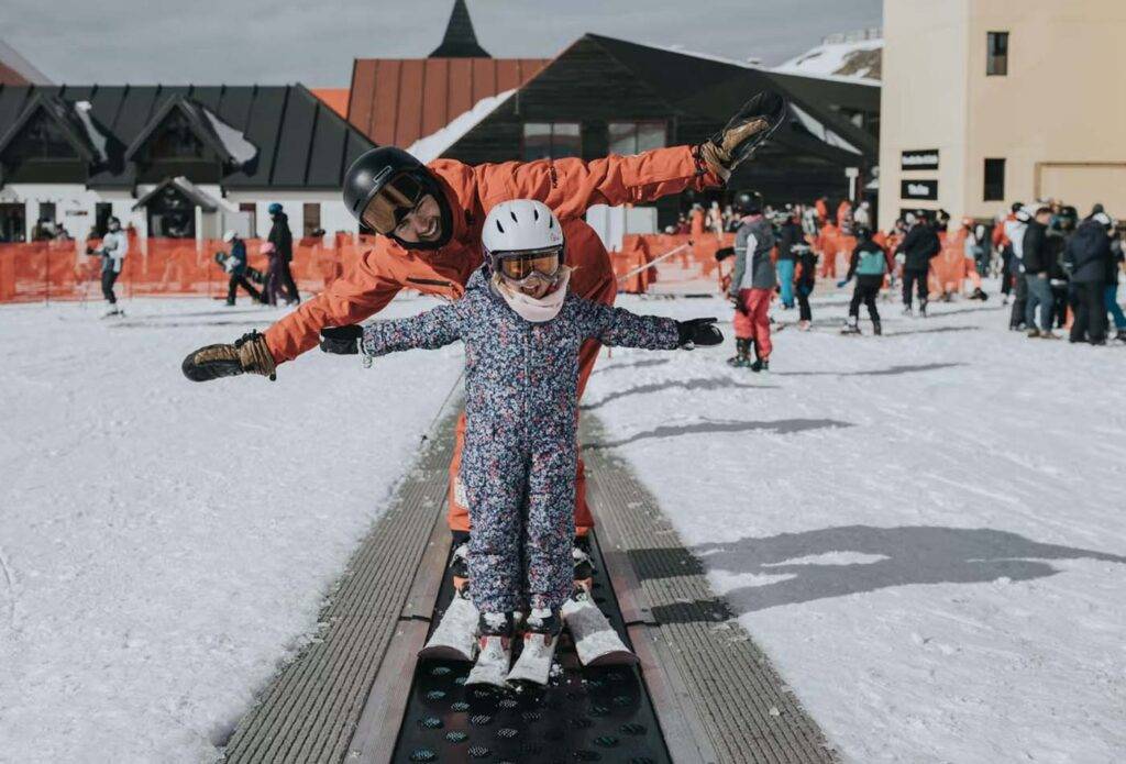 Father and daughter in ski gear