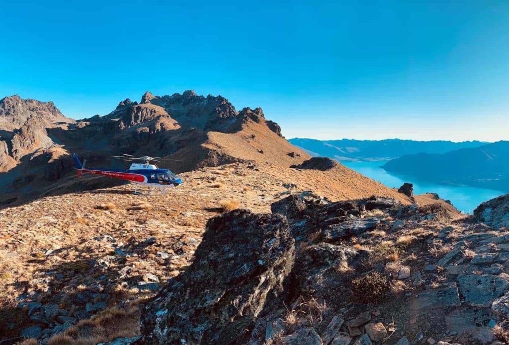Helicopter flying over mountains