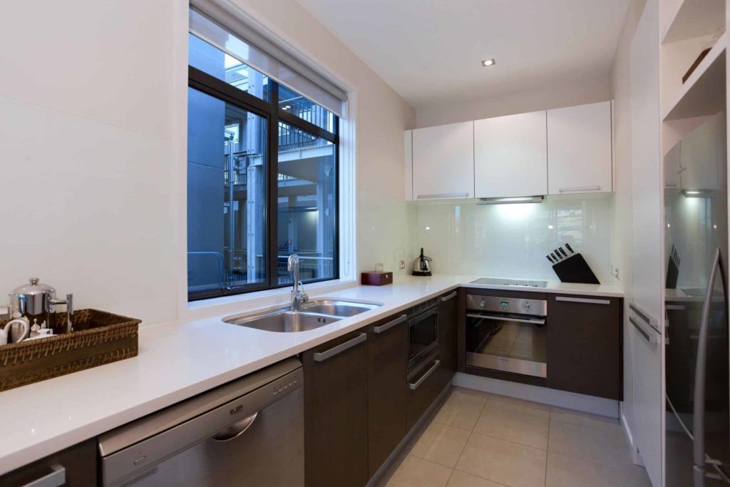Full kitchen with sink, oven range, and refrigerator: Lake View 2 Bedroom Apartment