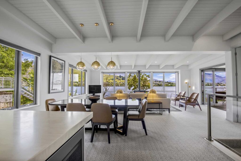 Rees Residence spacious dining and living room with lake view