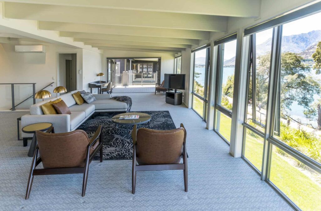 Rees Residence living room with sectional sofa and lake view