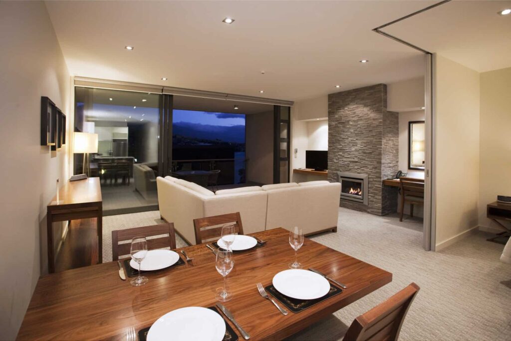 Superior 1 Bedroom Apartment dining and living room with balcony access