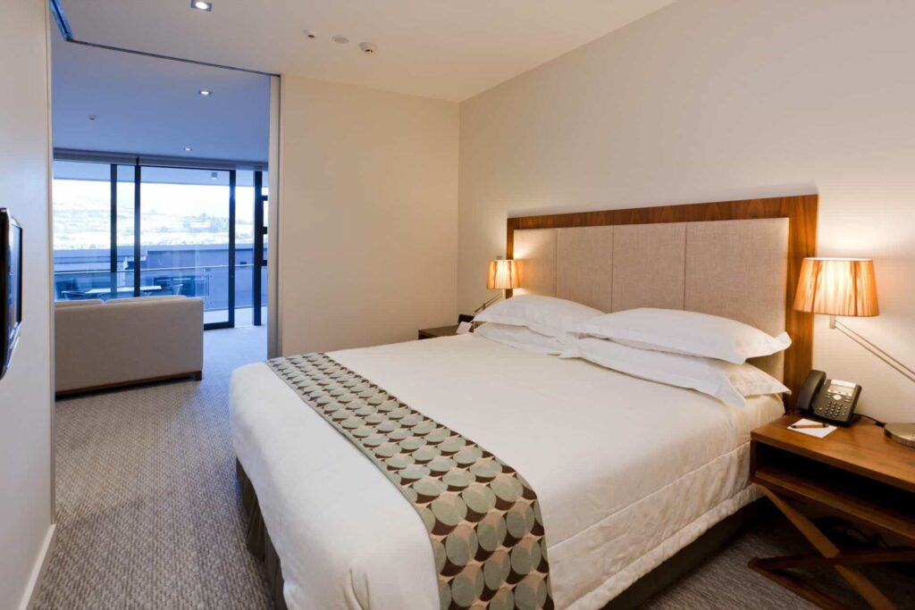 Superior 3 Bedroom Apartment bedroom with king bed